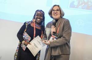 IAPA Au Pair of the Year Award Winner Jemimah Waceke Mwithiga receiving the Award from IAPA Managing Director Patricia Brunner