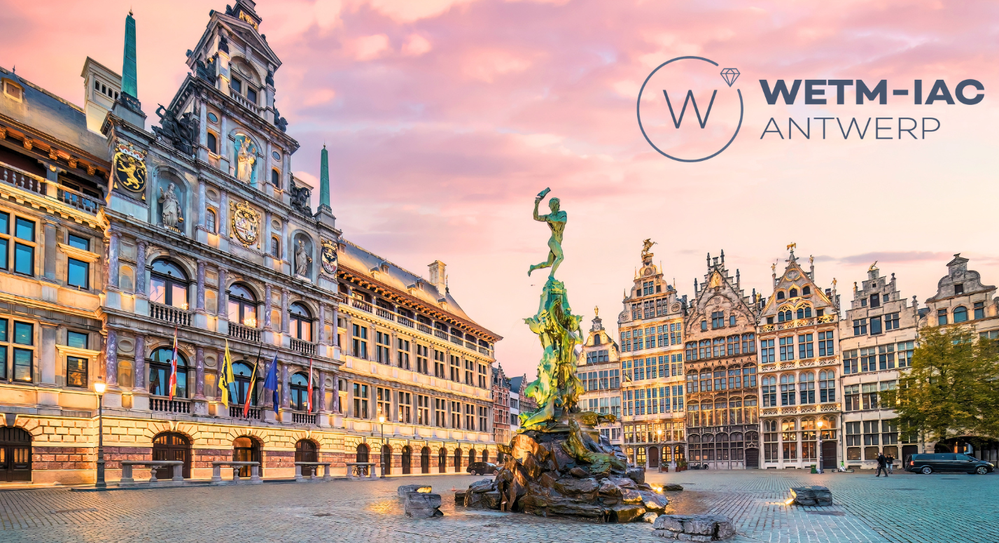 Antwerp Town Hall and Big Market in the evening with pink sky, WETN-IAC logo in dark blue in the right upper corner