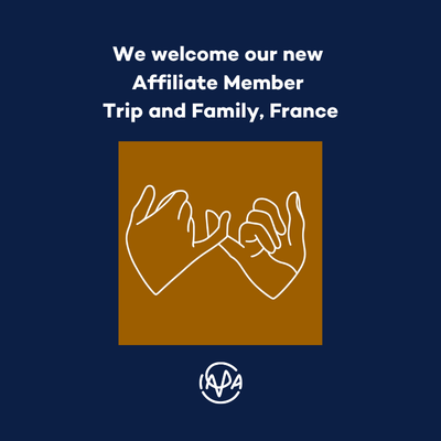 We welcome our new Affiliate Member Trip and Family, France. Dark blue background. logo of Trip and family brown background with outlines of two hands holding each other's small fingers. Below that the IAPA logo in white