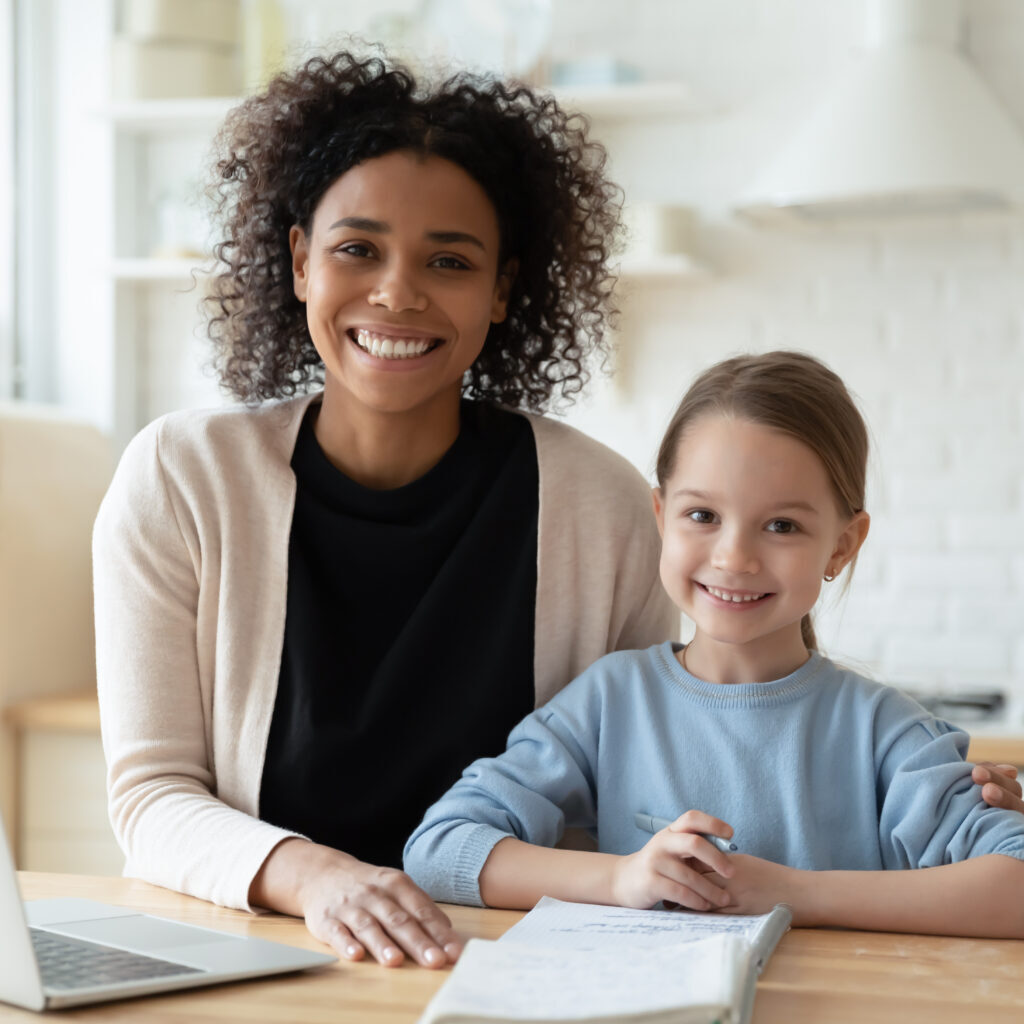 Au Pa ir with child doing homework